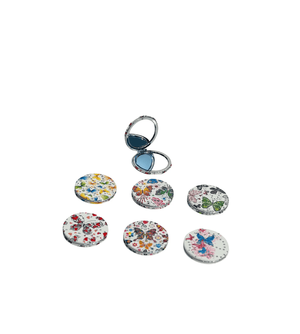 Set of floral and butterfly designs on round keychains with a silver ring on a white background