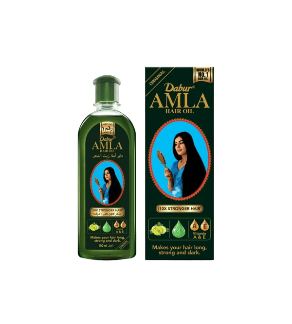 Dabur Amla hair oil bottle and packaging on a white background