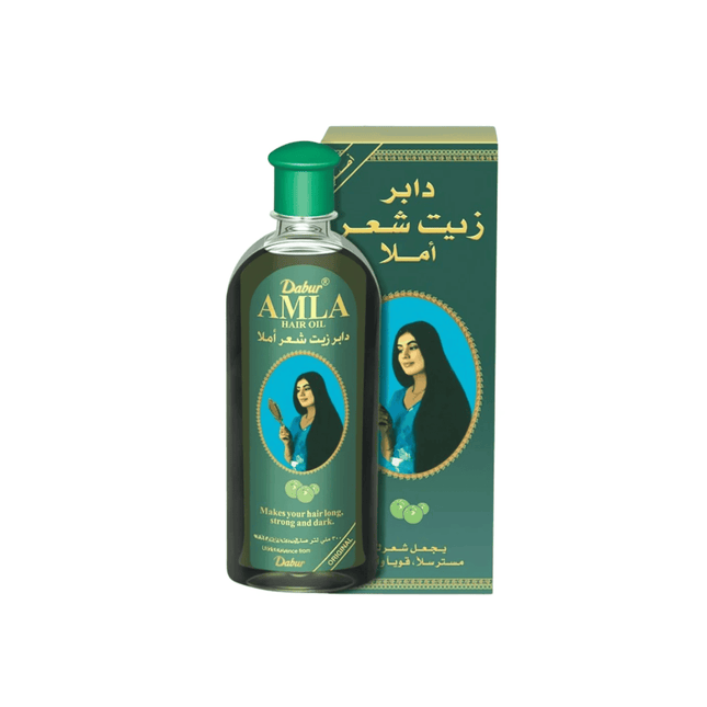 Dabur Amla hair oil bottle with packaging on a white background