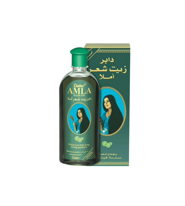 Dabur Amla hair oil bottle with packaging on a white background