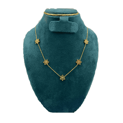 Necklace with colorful flower pendants on a green velvet stand