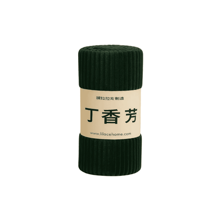 Dark green roll of fabric with a beige label on a white background