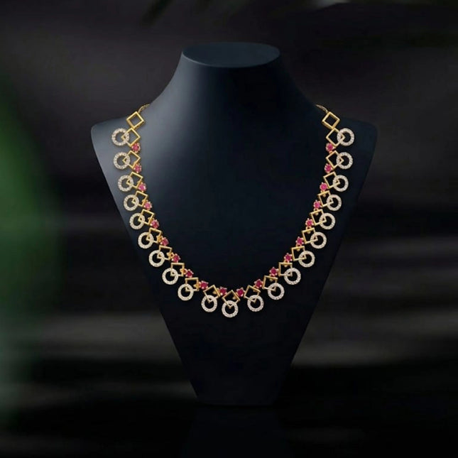 Decorative necklace on a black mannequin against a dark background