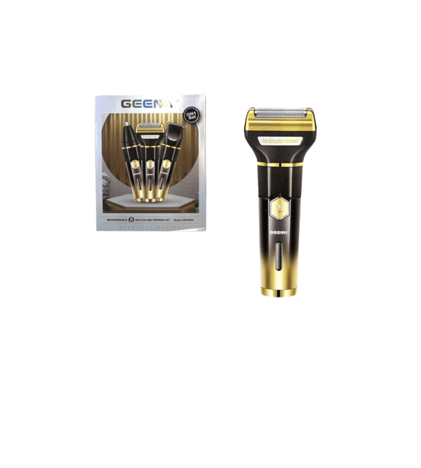 Gold and black electric shaver with packaging on a white background