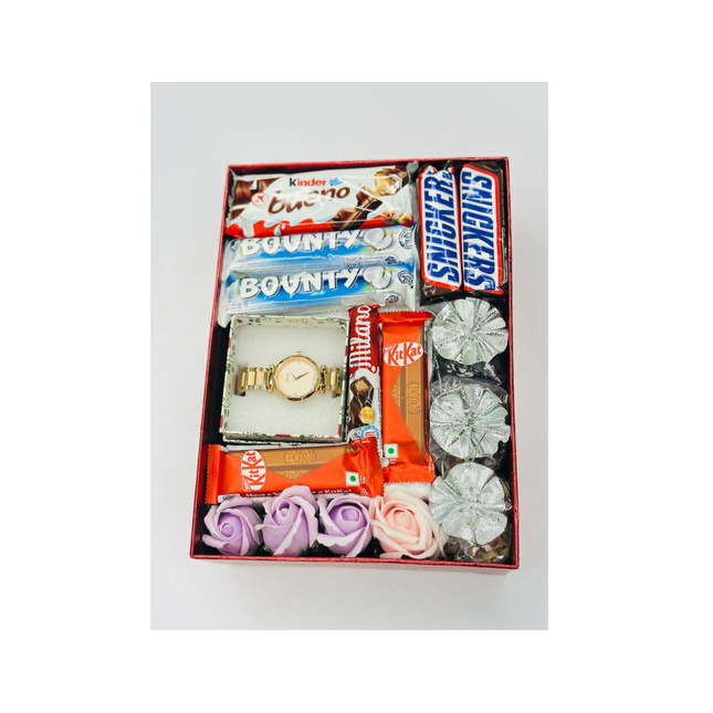 Gift set with snacks, a watch, and decorative items in a box on a white background