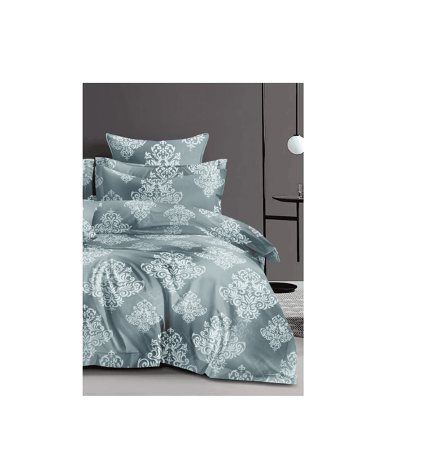 Blue floral patterned bedding set on a bed with a dark headboard.