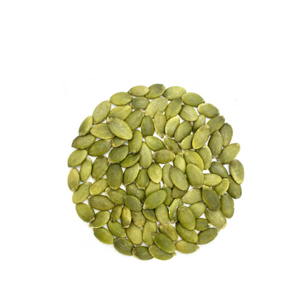 Pile of green pumpkin seeds on a white background