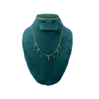 Heart chain with black stone drops with green velvet mannequin bust with white background