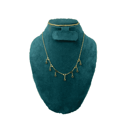 Heart chain with black stone drops with green velvet mannequin bust with white background