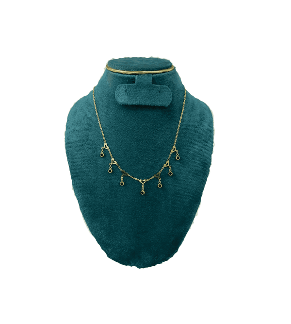 Heart chain with black stone drops with green velvet mannequin bust with white background