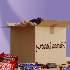 Open cardboard box with snacks and candy bars on a purple background
