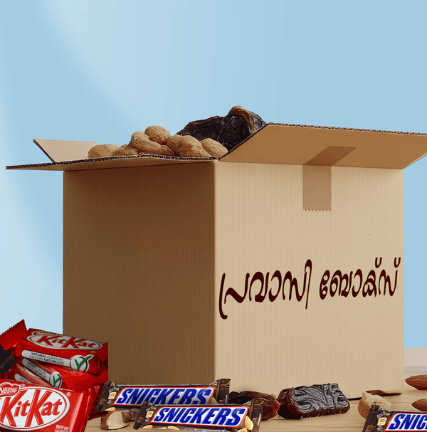 Open cardboard box with snacks and candy bars on a blue background
