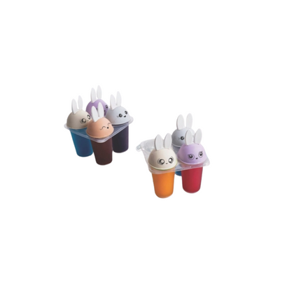 Set of colorful ice cream molds with bunny faces on a white background