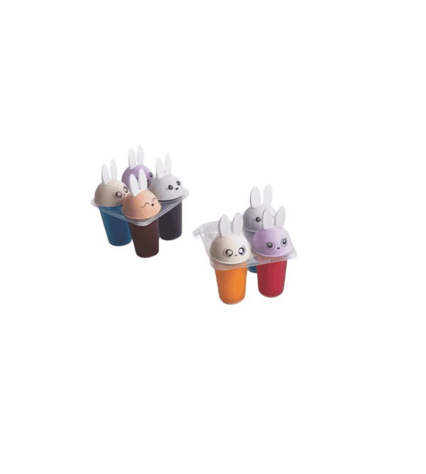 Set of colorful ice cream molds with bunny faces on a white background