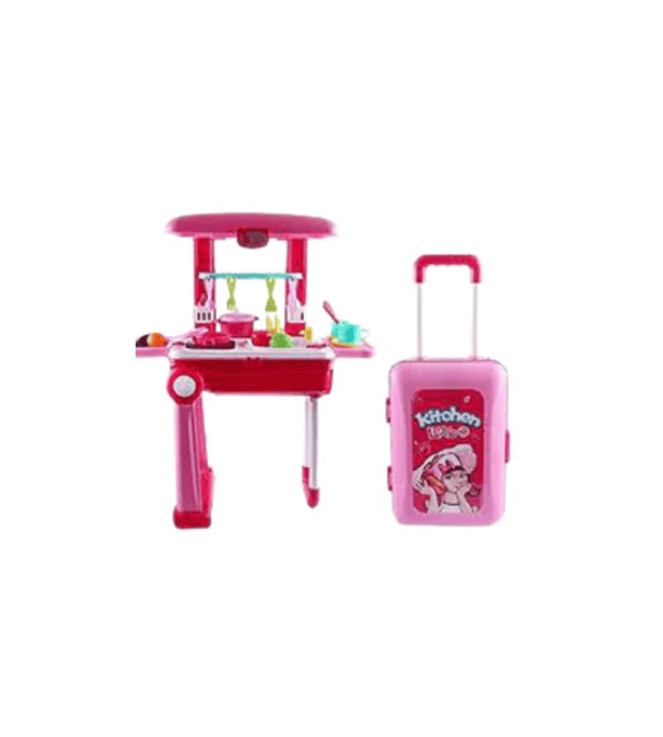 Pink toy kitchen set with a suitcase on a white background
