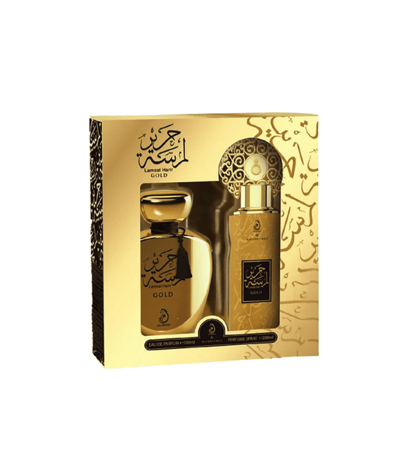 Gold perfume set with packaging on a white background