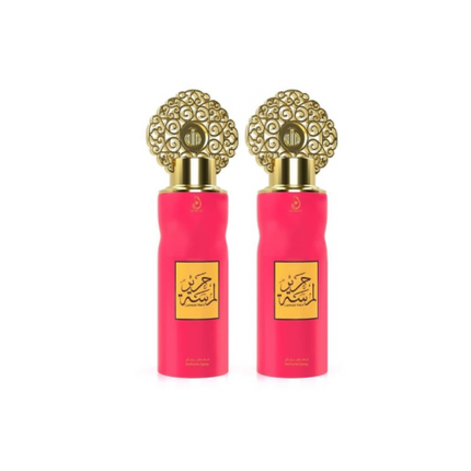 Two pink perfume bottles with gold caps on a white background