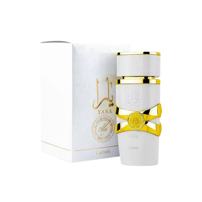 Perfume bottle with gold accents and packaging on a white background