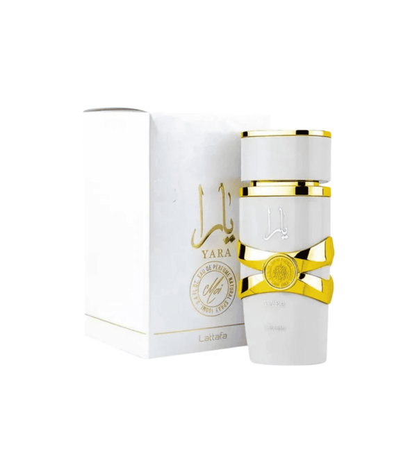 Perfume bottle with gold accents and packaging on a white background