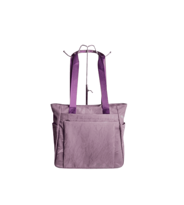 Purple tote bag with straps on a white background