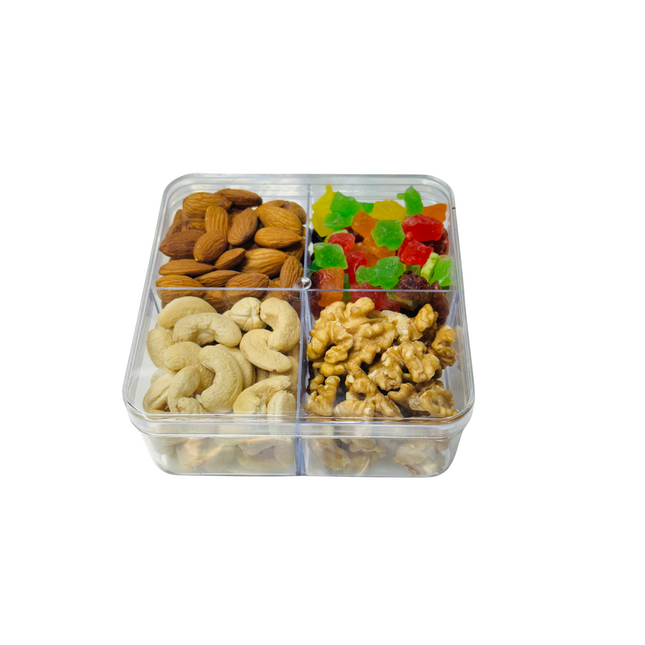 Clear plastic snack tray with almonds, cashews, walnuts, and gummy bears on a white background