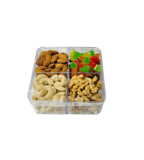 Clear plastic snack tray with almonds, cashews, walnuts, and gummy bears on a white background