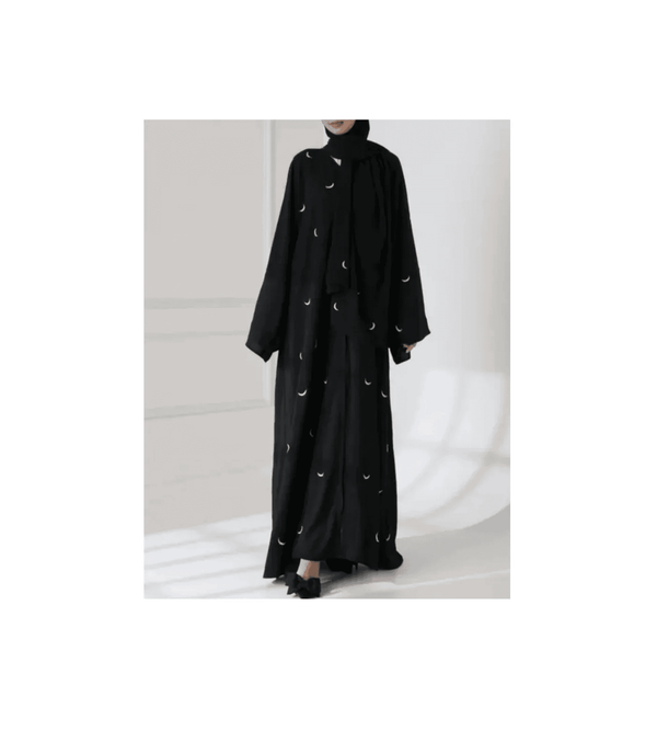Black abaya with white embroidery on a white background
