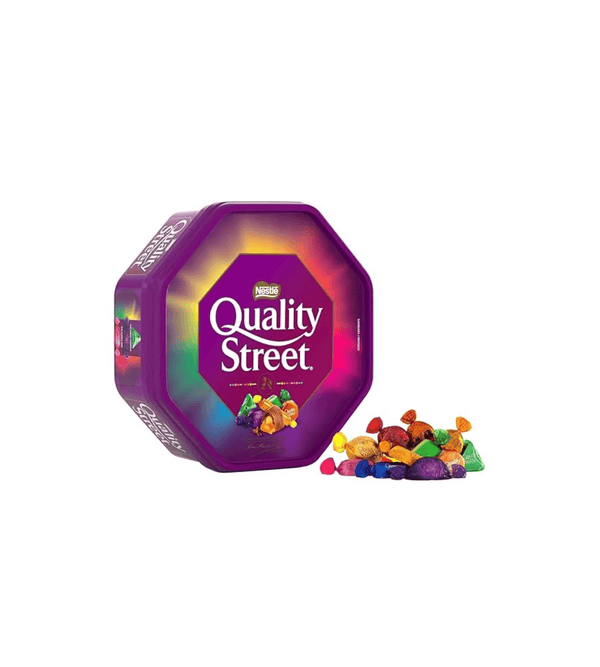 Quality Street chocolate tin with colorful candy pieces on a white background