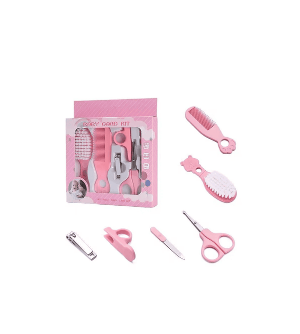 Pink pet grooming kit with tools on a white background