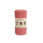 Pink textured roll of fleece blanket with a label on a white background