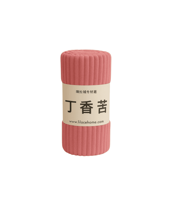 Pink textured roll of fleece blanket with a label on a white background