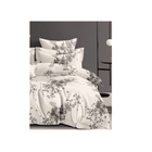 Floral patterned bedding set on a bed with a neutral background