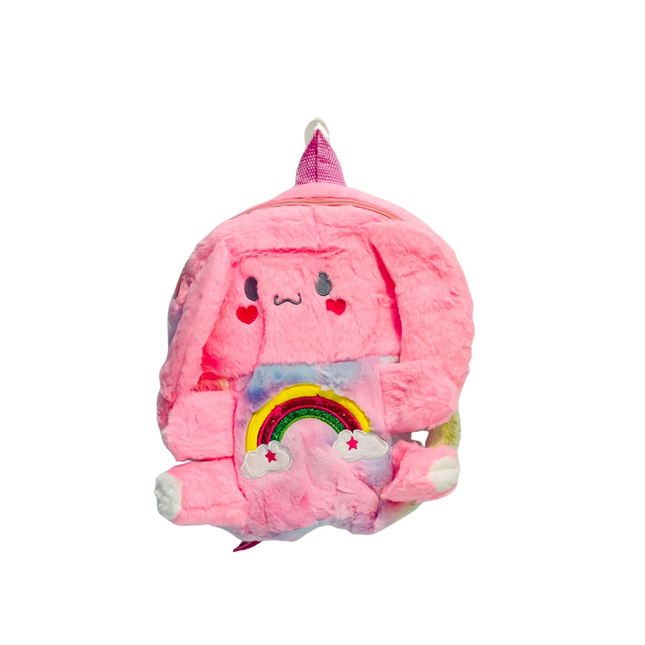 Pink plush backpack with cartoon face and rainbow design on a white background