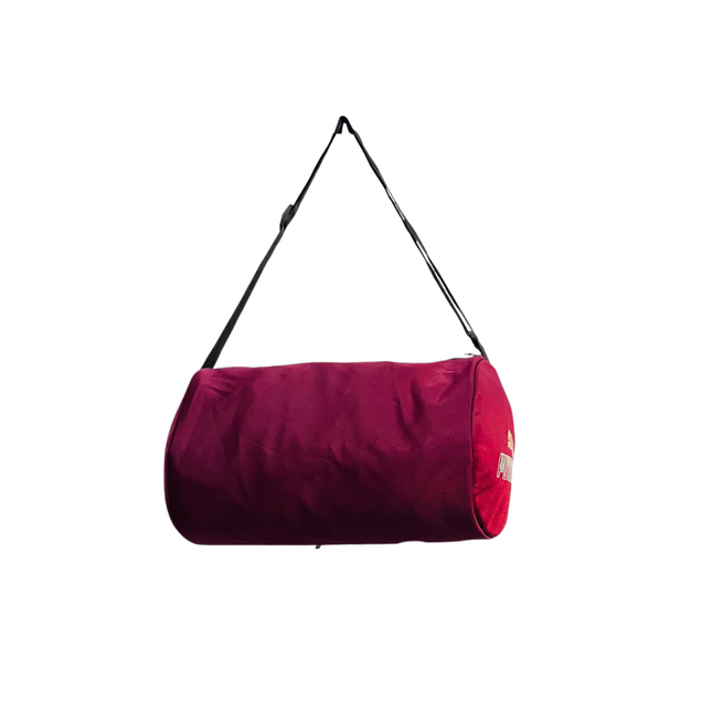 Red duffel bag with a strap on a white background