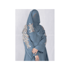 Blue abaya with floral embroidery on a white background
