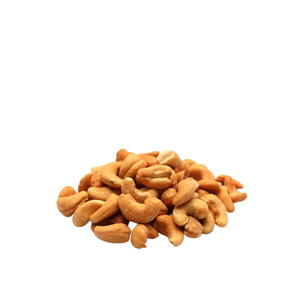 Pile of salted cashews  roasted on a white background