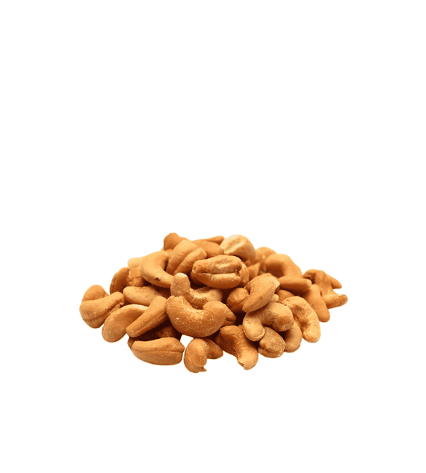 Pile of salted cashews  roasted on a white background