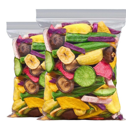 Two clear bags filled with colorful dried fruit slices on a white background