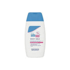 Baby body milk bottle with blue cap and white label on a white background