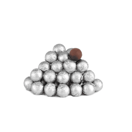 Pyramid of silver balls with a single brown ball on a white background