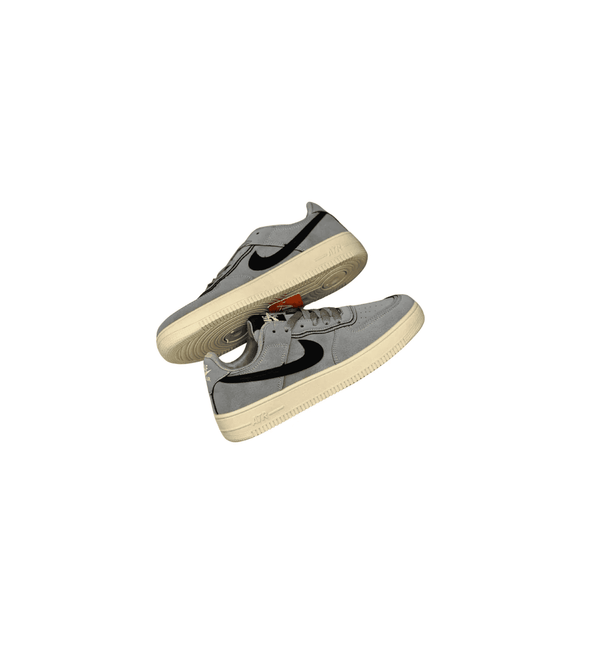 Pair of gray sneakers with a white sole on a white background