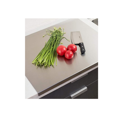 Kitchen counter with vegetables and a knife on a white background