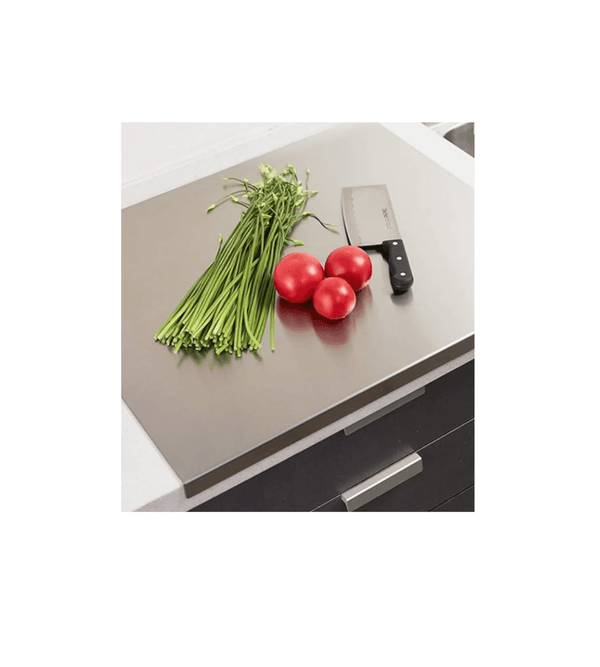 Kitchen counter with vegetables and a knife on a white background
