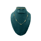 Teal jewelry display with necklace  on a white background