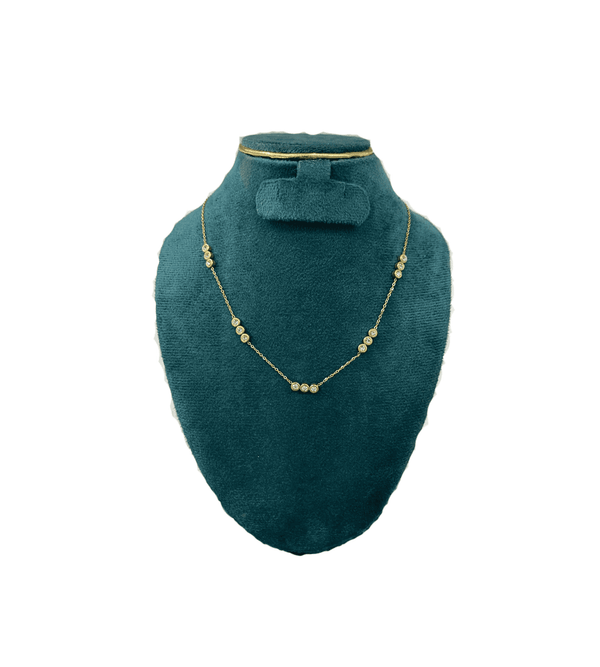 Teal jewelry display with necklace  on a white background