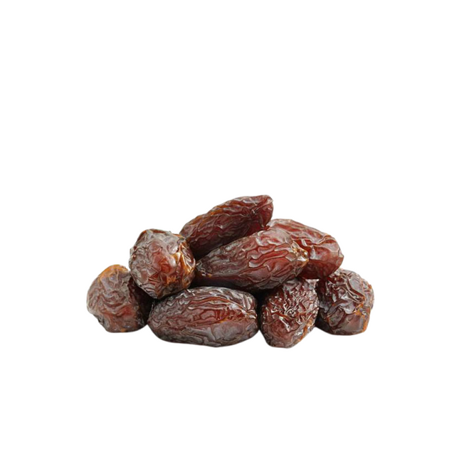 Pile of dried dates on a white background
