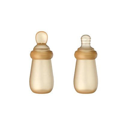 Two baby bottles with silicone caps on a white background