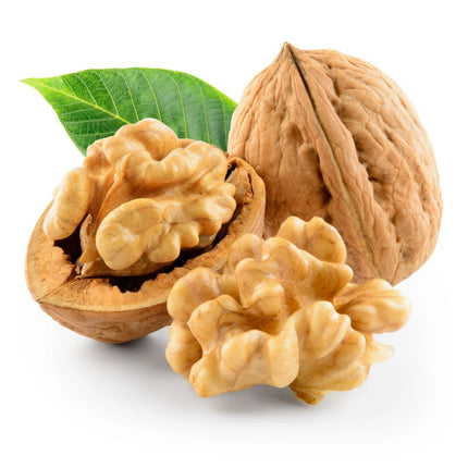Three walnuts with a green leaf on a white background