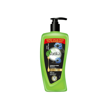 Green bottle with pump of Vatika hair care product on a white background