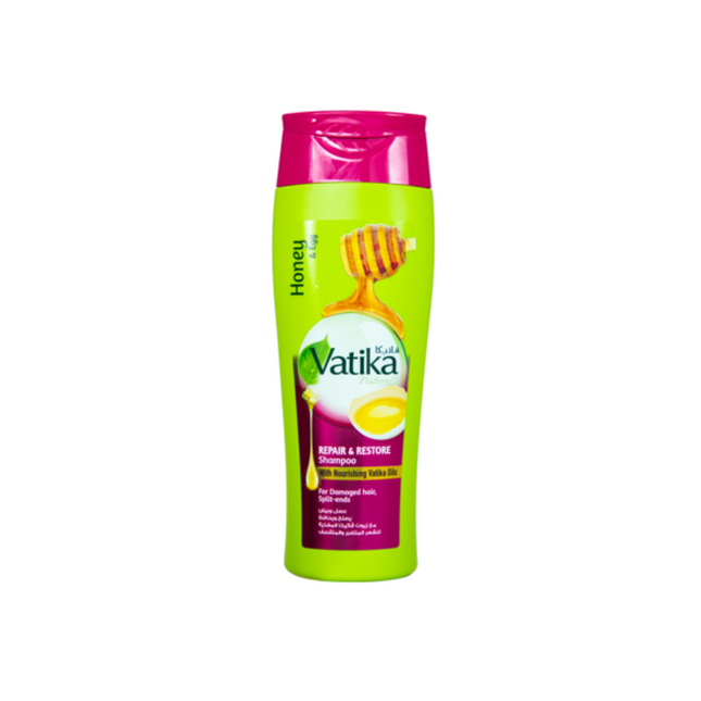 Vatika shampoo bottle with green body and pink cap on a white background